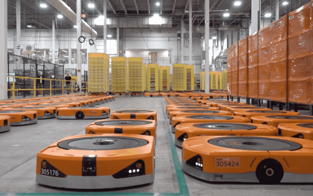 Amazon's use of robotic systems in fulfillment centers showcases the potential of automation. Image Source: Waredock